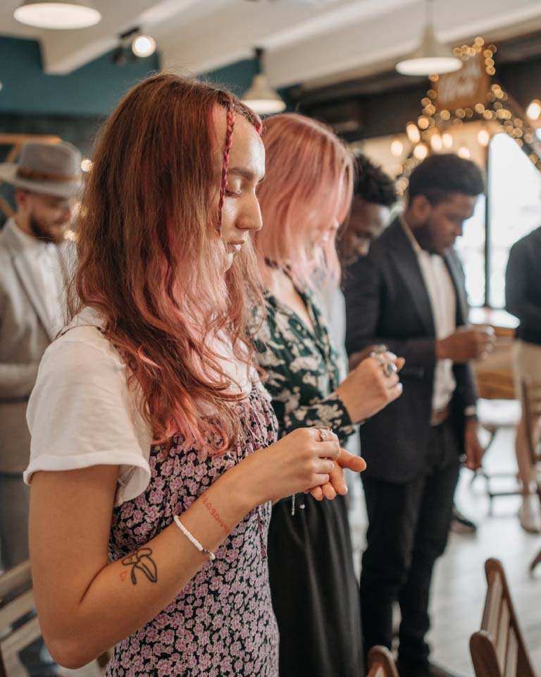 Woman worshiping during church service